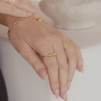 Moderner drehbarer Ring mit Perlen