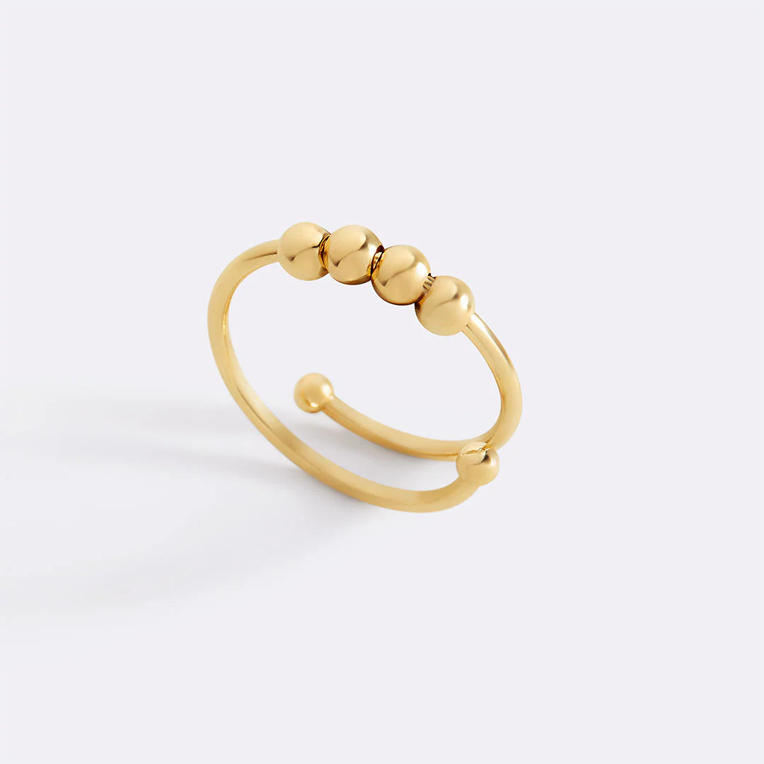 Moderner drehbarer Ring mit Perlen