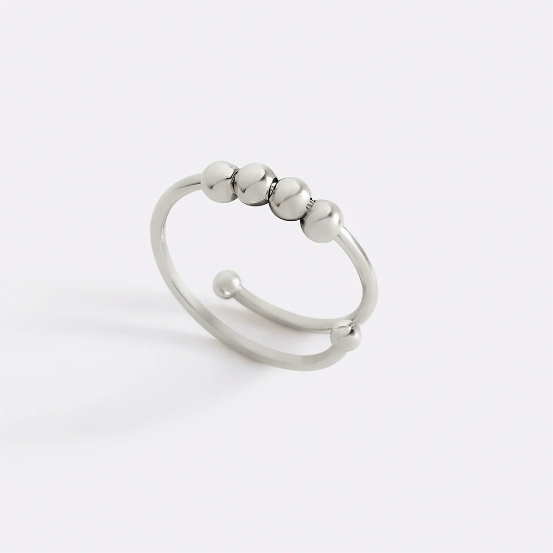 Moderner drehbarer Ring mit Perlen
